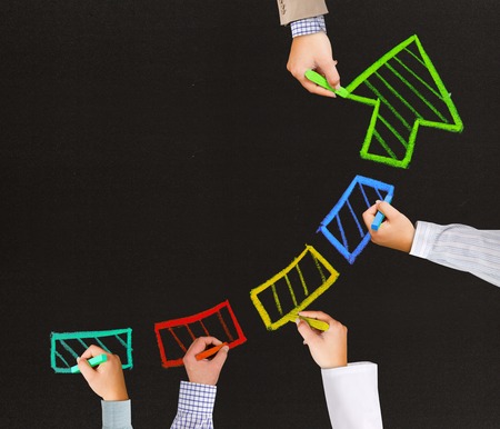 Photo of business hands writing arrow pointing upの写真素材