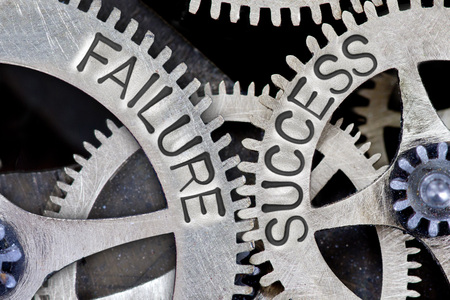 Macro photo of tooth wheel mechanism with FAILURE, SUCCESS lettersの写真素材