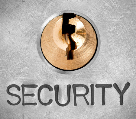 Photo of lock on metal surface with SECURITY word imprintedの写真素材