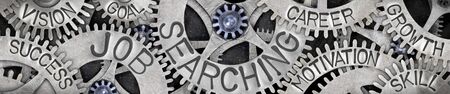 Large group of tooth wheels with Job Searching, Vision, Goal and Success concept related words imprinted on metal surface.の写真素材