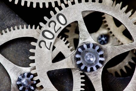 Tooth wheel mechanism with numbers 2020, 2019 imprinted on metal surface. New Year concept.の写真素材