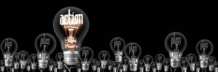 Group of shining and dimmed light bulbs with fibers in a shape of Action and Plan words isolated on black background; concept of Motivation and Successの写真素材
