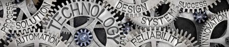 Large group of tooth wheels with Technology, Automation, Solution, Design and System concept related words imprinted on metal surface; horizontal compositionの写真素材