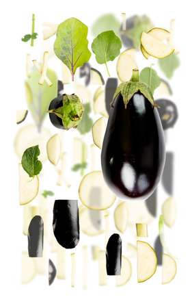 Abstract background made of Eggplant vegetable pieces, slices and leaves isolated on white.の写真素材