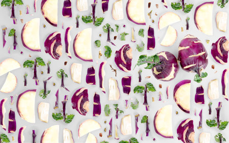 Abstract background made of Kohlrabi vegetable pieces, slices and leaves isolated on gray background.の写真素材