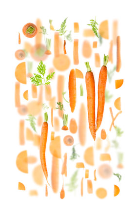 Abstract background made of Carrot fruit pieces, slices and leaves isolated on white.の写真素材