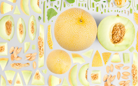 Abstract background made of Sugar Melon fruit pieces, slices and leaves isolated on gray background.の写真素材