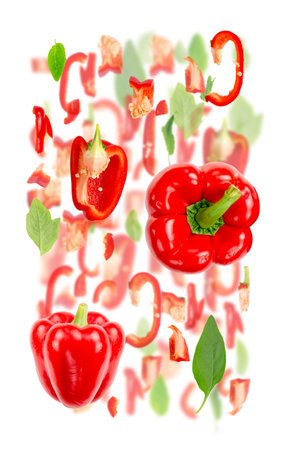 Abstract background made of Red Pepper vegetable pieces, slices and leaves isolated on white.の写真素材