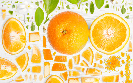 Orange Citrus fruit piece, slice and leaf collection. Flat lay, seamless abstract, gray background.の写真素材