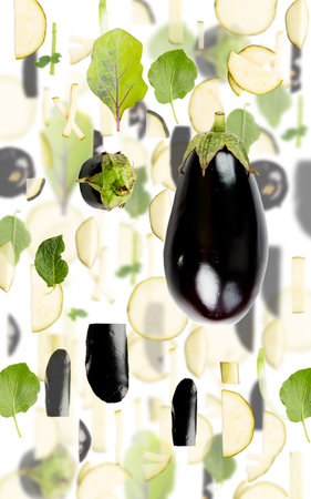 Abstract background made of Eggplant vegetable pieces, slices and leaves isolated on white.の写真素材
