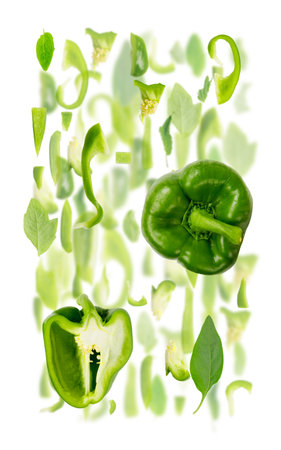 Abstract background made of Green Pepper vegetable pieces, slices and leaves isolated on white.の写真素材
