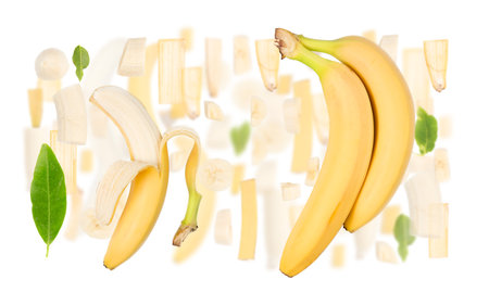 Abstract background made of Banana fruit pieces, slices and leaves isolated on white.の写真素材