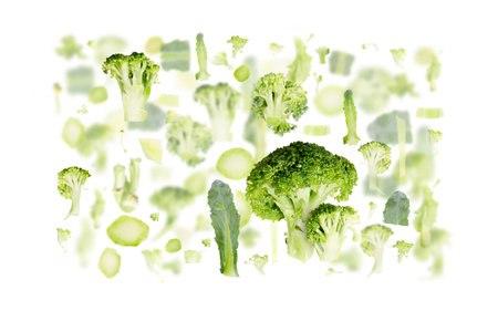 Abstract background made of Broccoli fruit pieces, slices and leaves isolated on white.の写真素材