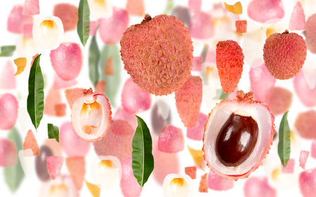 Abstract background made of Litchi fruit pieces, slices and leaves isolated on white.の写真素材