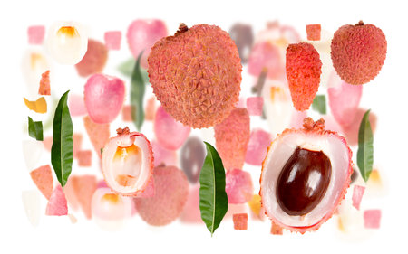 Abstract background made of Litchi fruit pieces, slices and leaves isolated on white.の写真素材
