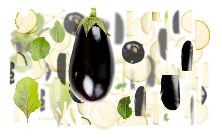 Abstract background made of Eggplant vegetable pieces, slices and leaves isolated on white.の写真素材
