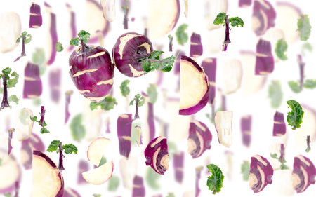 Abstract background made of Kohlrabi vegetable pieces, slices and leaves isolated on white.の写真素材