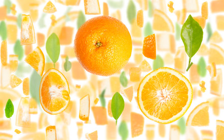 Abstract background made of Orange Citrus fruit pieces, slices and leaves isolated on white.の写真素材