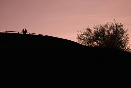  Silhouette of a Couple on a Hillの写真素材