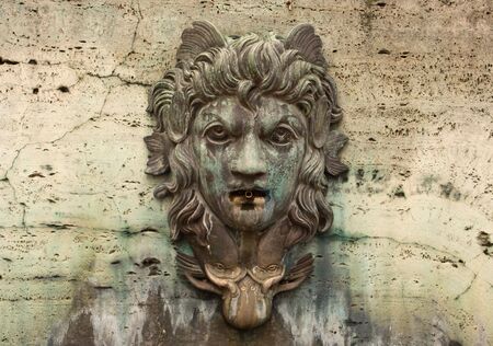 Face on a Water Fountain with Patinaの写真素材
