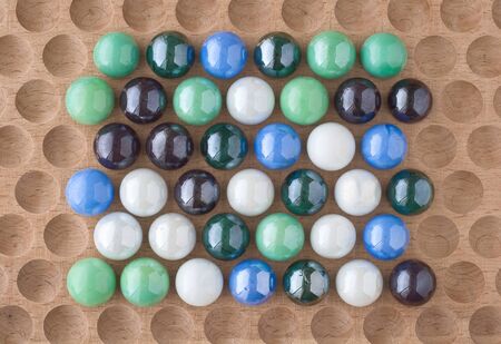 Arrangement of Marbles as Design Elements on Wood の写真素材