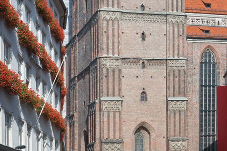 Frauenkirche and Surrounding Buildings with Geraniums in Munichの写真素材