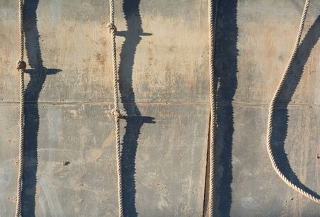 Muddy Rappelling Wall with Rope as Healthy Exerciseの写真素材