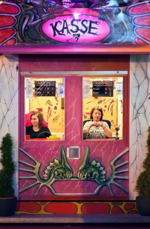 MUNICH, GERMANY â Oct. 2, 2015: Two Ladies Selling Tickets for an Event at the Annual Oktoberfest. The Festival runs from September 19th until October 4th 2015 in Munich, Germanyのeditorial素材