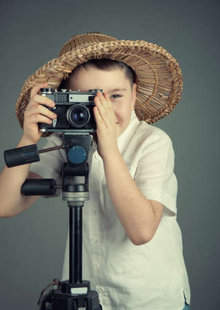 Boy with the  camera in studioの写真素材