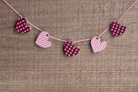 Five hearts on wooden backgroundの写真素材