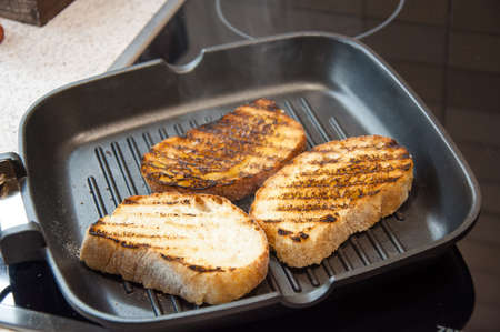 Thick slices of freshly baked garlic bread seasoned with butter 