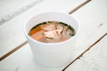 fish soup with salmon in plastic boxの写真素材