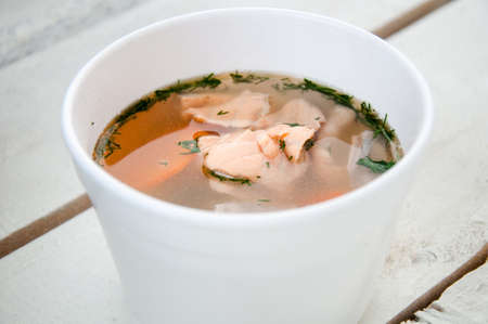 fish soup with salmon in plastic boxの写真素材