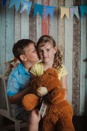 young children playing with toys in studioの写真素材