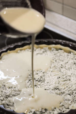 Preparation of the pie with cottage cheese,feta and parsleyの写真素材