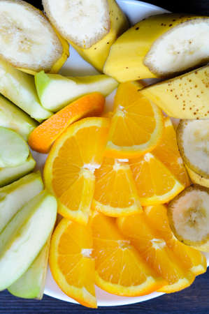Assortment of juicy fruit on the plateの写真素材