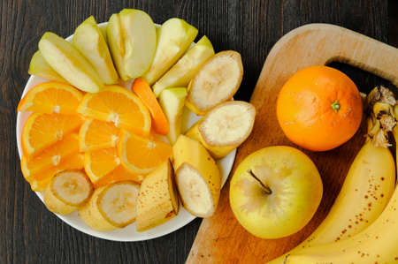 Assortment of juicy fruit on the plateの写真素材