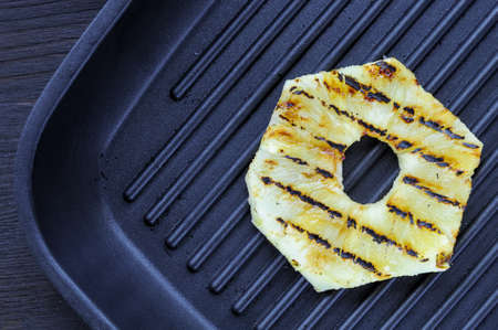 Fried pineapple on the grill. Preparing sandwichの写真素材