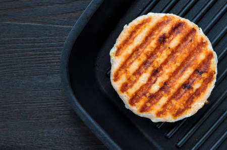 Fried salmon on the grill. Preparing sandwichの写真素材