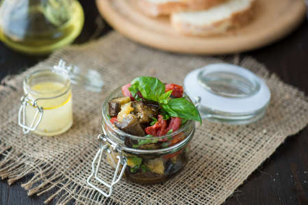 Baked eggplant with tomatoes in the jarの写真素材