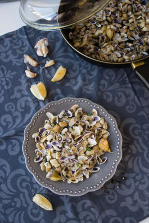 fried clams with roasted paste,garlic, lemon, cilantroの写真素材
