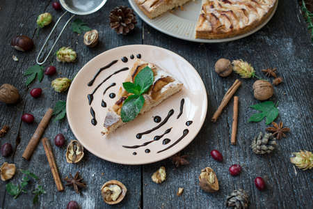 Slice of homemade apple pie on wooden tableの写真素材