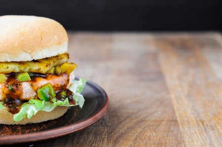 Fresh salmon sandwich with salad, avocado and pineapple.の写真素材
