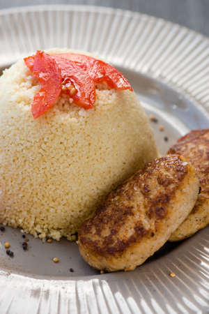 homemade vegetarian couscous made with bell pepper, tomatoの写真素材