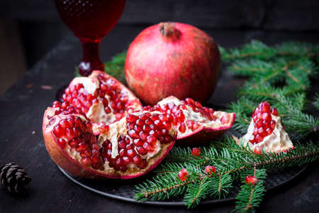 Pomegranate with festive decorationsの写真素材