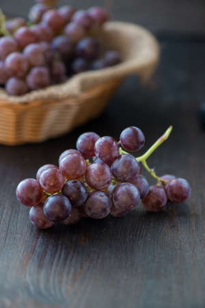 Organic Raw Red Grapes in a Basketの写真素材