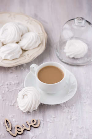 White apple marshmallows, homemade zephyr with coffeeの写真素材