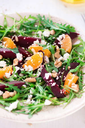 fresh salad beetroot, arugula, mandarins, cheeseの写真素材