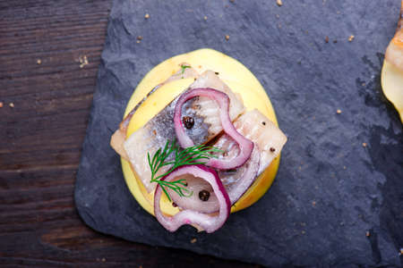 Appetizer canape with herring and applesの写真素材