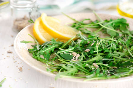 fresh arugula salad with sunflower seeds, sesameの写真素材
